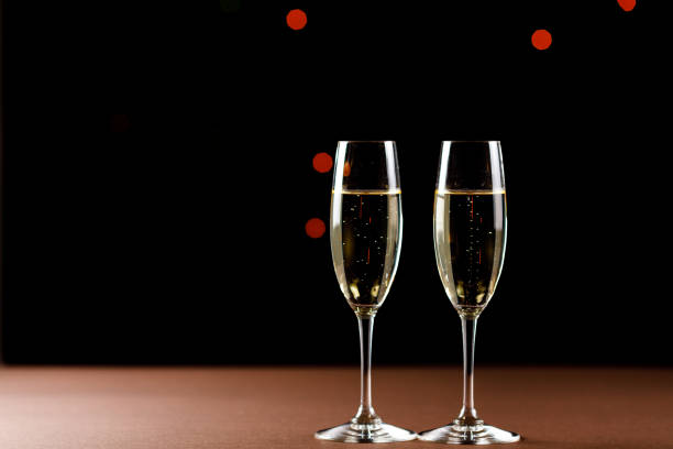 istock Champagne glasses on black background. Holiday celebration concept. 1139556207