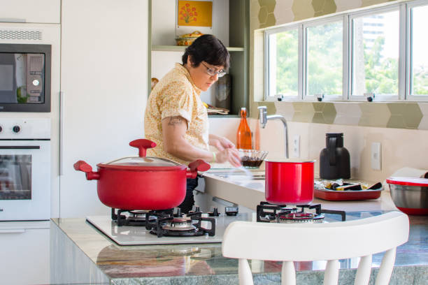 istock Woman cooking happy 1139558759