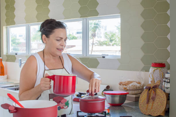 istock Woman cooking happy 1139558806