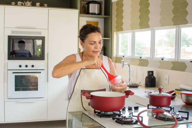 istock Woman cooking happy 1139558979