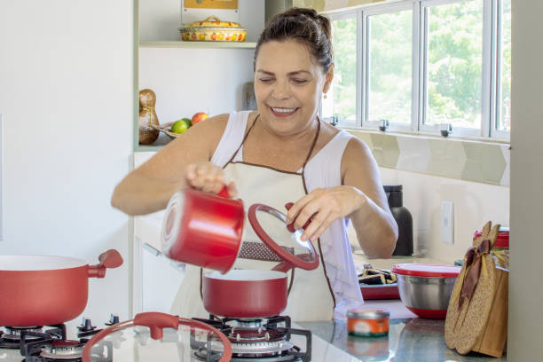 istock Woman cooking happy 1139558995