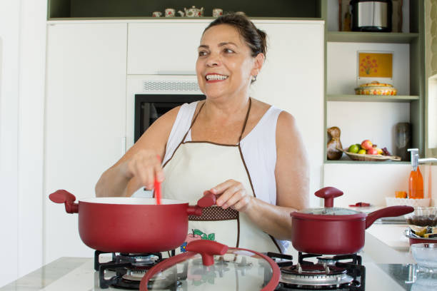 istock Woman cooking happy 1139559041