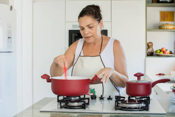 istock Woman cooking happy 1139559067