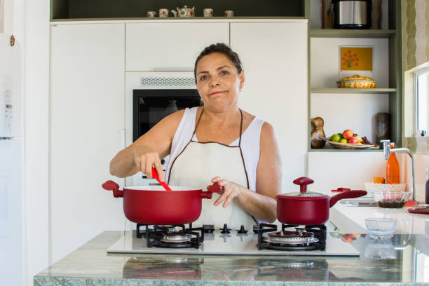 istock Woman cooking happy 1139559635