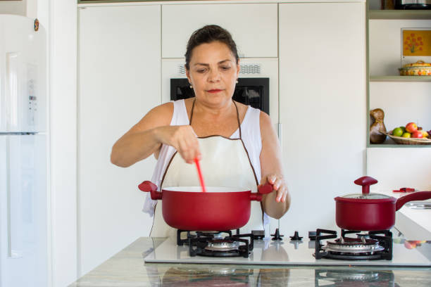istock Woman cooking happy 1139559658