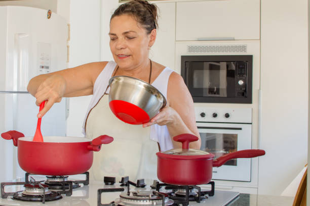 istock Woman cooking happy 1139559714