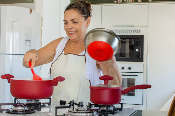 istock Woman cooking happy 1139559715