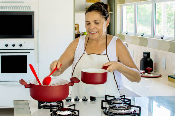 istock Woman cooking happy 1139559751