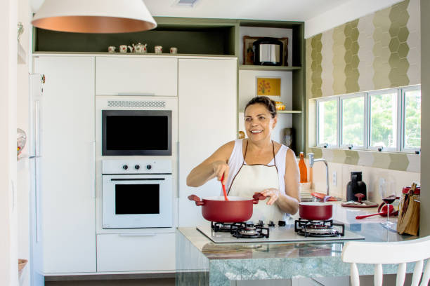 istock Woman cooking happy 1139559752