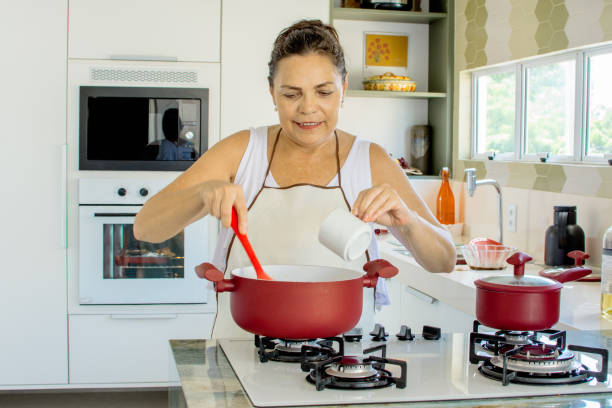 istock Woman cooking happy 1139559818