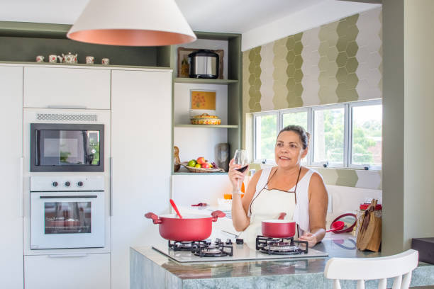 istock Woman cooking happy 1139559897