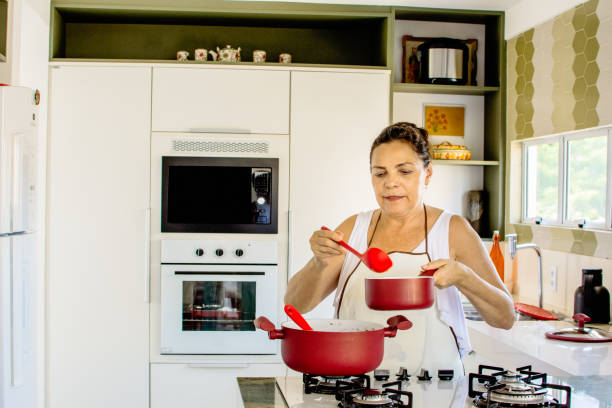 istock Woman cooking happy 1139559956