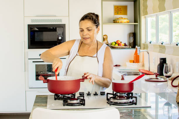 istock Woman cooking happy 1139559989