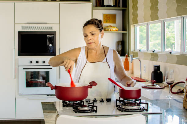 istock Woman cooking happy 1139560016