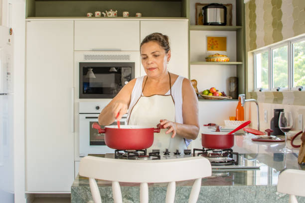 istock Woman cooking happy 1139560031