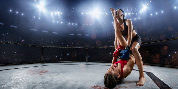 istock Female MMA fighters in professional boxing ring 1139567119