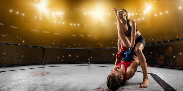 istock Female MMA fighters in professional boxing ring 1139567121