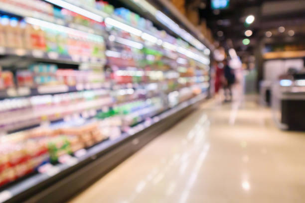 istock Abstract supermarket aisle interior blurred defocused background with bokeh light 1139567313
