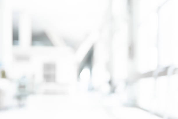 istock Abstract blurred white doctor medical office room background concept for blur empty space grey modern hospital clinic pharmacy, light clean interior retail sale, blue glare window hallway building 1139567390