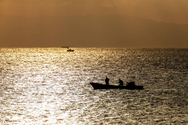 istock Fishing boat bathing in the morning glitter 1139571057