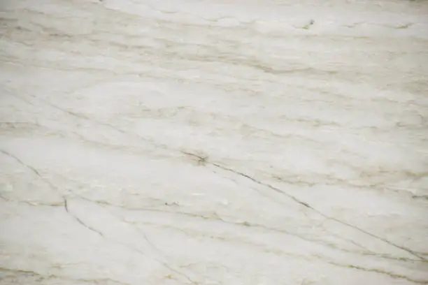 Closeup white quartzite stone with natural pattern texture background.