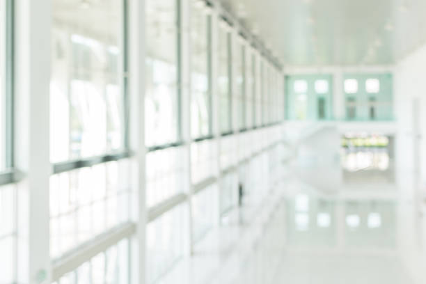 istock Office building blur background business lobby reception hall interior or empty indoor foyer meeting room with blurry light from glass wall window 1139572249