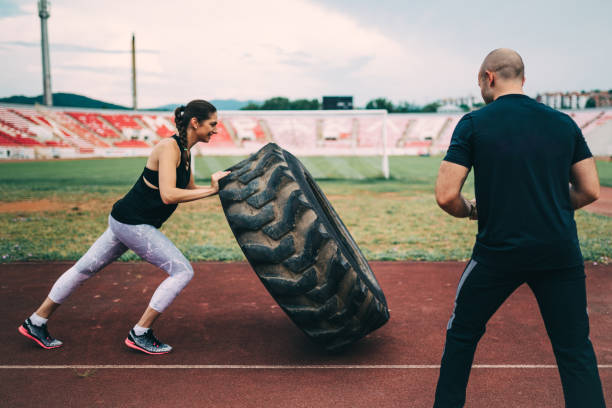 istock Female athlete having a weight lifting training at the stadium 1139573077