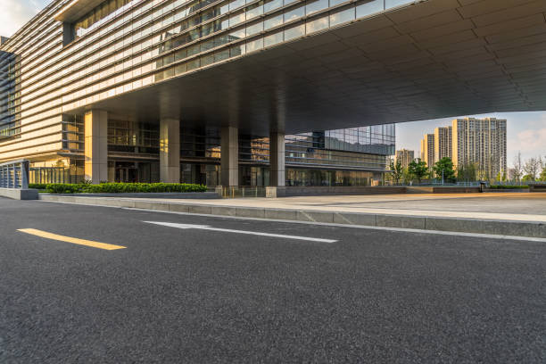istock empty road and modern office buildings at dusk 1139579700