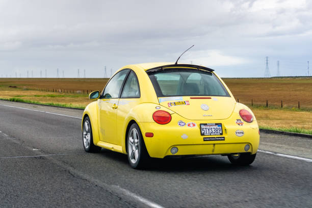 March 20, 2019 Los Angeles / CA / USA - Yellow Volkswagen Beetle driving on the interstate