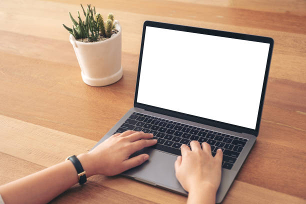 istock a woman using and typing on laptop with blank white screen 1139580510