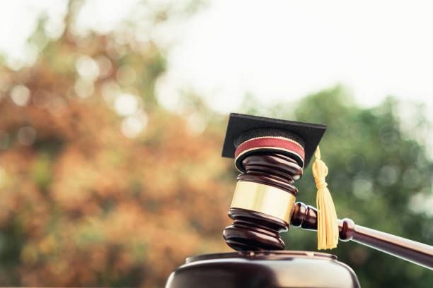 Graduation diploma hat / Judge gavel on school lawyer. Concept of graduate study international abroad about jurisprudence laws certificate in university, distance education for learning by self stock photo