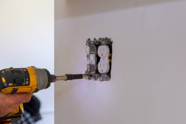 istock Electrician repairing wall switch indoors 1139582509