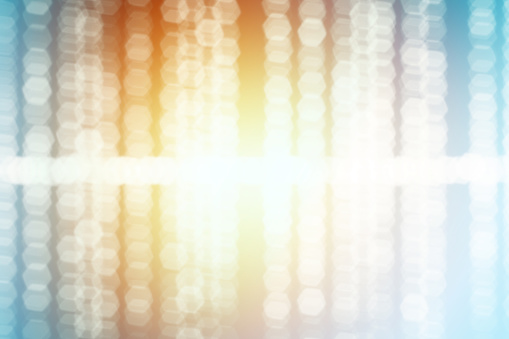 Colorful defocused sound wave lights background.