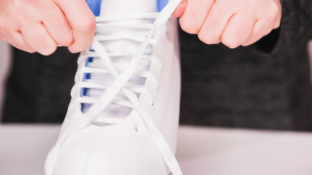 istock Lacing new white figure skates with white laces. 1139583379