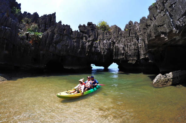 Stone Castle Unseen Satun Amazing Satun, Thailand - March 2, 2019: Tourists being rowed or kayaking through cave at Stone Castle (Prasathinphanyod), Koh Khao Yai  is under Pae Tra Islands National Park in Satun Province, Thailand satun province stock pictures, royalty-free photos & images