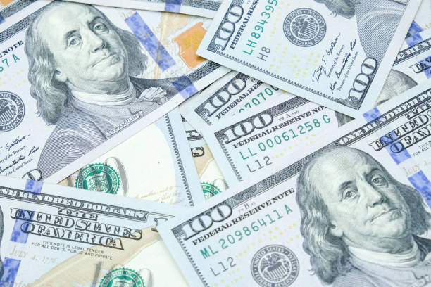 istock Pile of One hundred dollars banknotes pattern. 1139583581