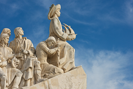 Lisbon, Portugal-12 17 2014:Detail of the sculpture of the Monument of the Discoveries,(the Padrão dos Descobrimentos) located on the edge of the Tagus estuary in Lisbon, portugal.The monument celebrates the Portuguese Age of Exploration during the 15th and 16th centuries.\nalong the ramp, are figures representing figures from the Portuguese Age of Discovery. These great people of the era included monarchs, explorers, cartographers, artists, scientists and missionaries.