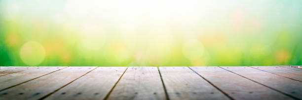 istock Sunny meadow over wooden deck 1139586869