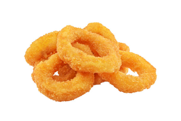 Squid or onion rings isolated Heap of deep fried squid or onion rings isolated on white background fried onion rings stock pictures, royalty-free photos & images