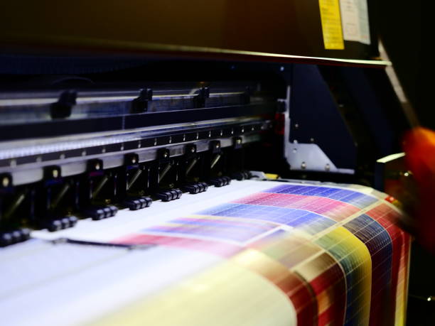 Inkjet printer working multicolor on vinyl banner Computer Printer, Digitally Generated Image, Printmaking Technique, Printout, Paper digital printing house stock pictures, royalty-free photos & images