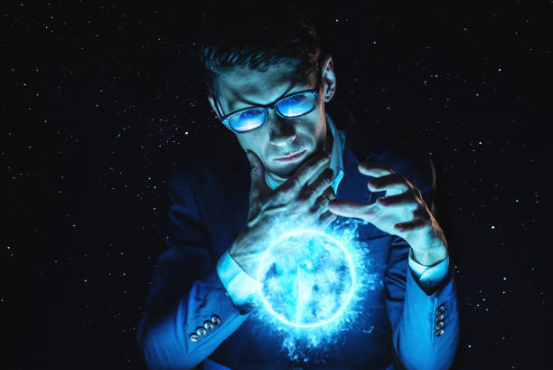 A man businessman holding hands over a blue glowing plasma sphere. Magic prediction and foresight in business and Finance