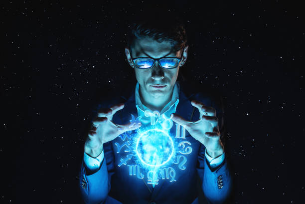 istock Businessman holding hands over the magic sphere with a horoscope to predict the future. Astrology as a business 1139597570