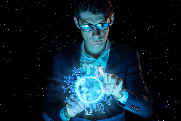 istock Businessman holding hands over the magic sphere with a horoscope to predict the future. Astrology as a business 1139597574