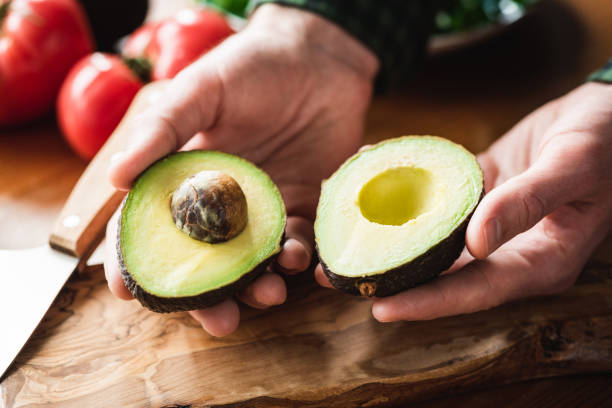 istock Fresh ripe avocado in male hands 1139597610