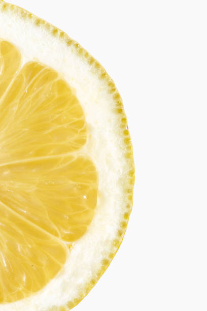 Backlit pile of lemon slices on white