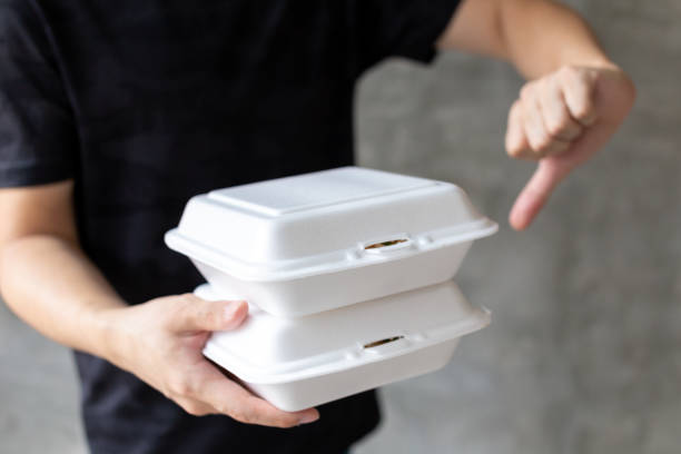 istock Man holding foam boxes and showing thumb down 1139599902