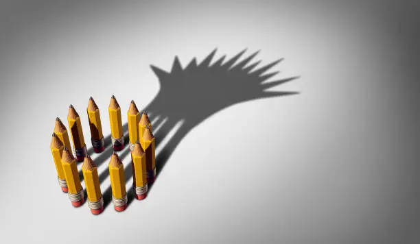 Business planning leadership concept as a group of pencils casting a shadow of a king crown working together as a team success plan to lead as a 3D illustration.