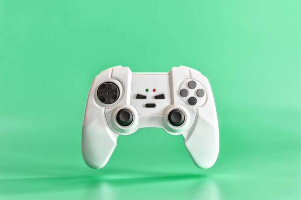 istock White game joystick on a green background. Minimal concept. 1139602473