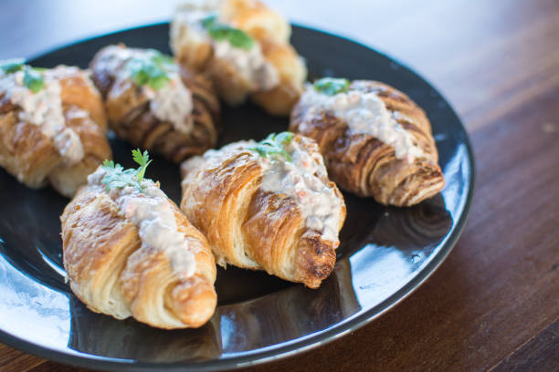 istock Croissant with Tuna Salad  Sandwich on wood table 1139603775