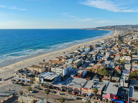 Aerial view of Mission Bay & beaches in San Diego, California, USA. Community built on a sandbar with villas, sea port and recreational Mission Bay Park. Californian beach-lifestyle.